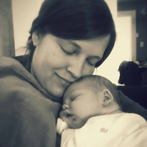 Katie loves the peach fuzz on his head